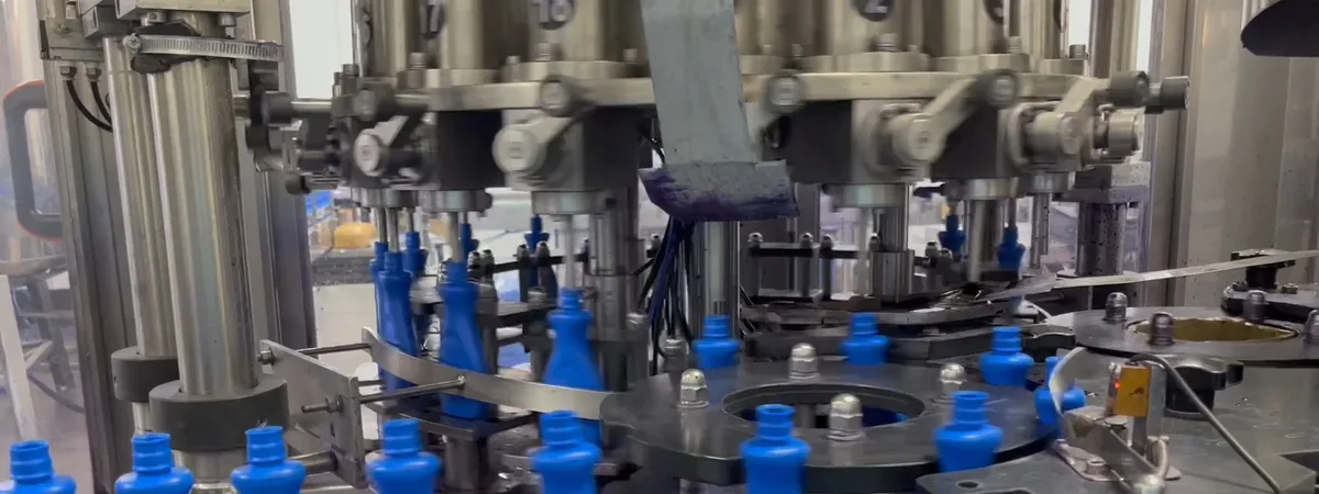 EDELSTEIN rotary filling machine capping blue detergent bottles