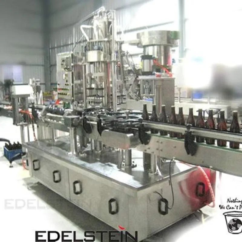 EDELSTEIN rotary crown cap capping machine on a beer bottle line